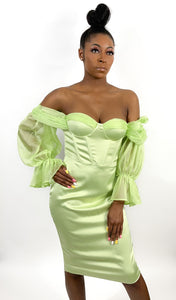 Green off-shoulder corset dress with ruffle sleeves.