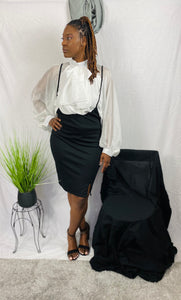 Fitted, knee-length, black overall skirt.
