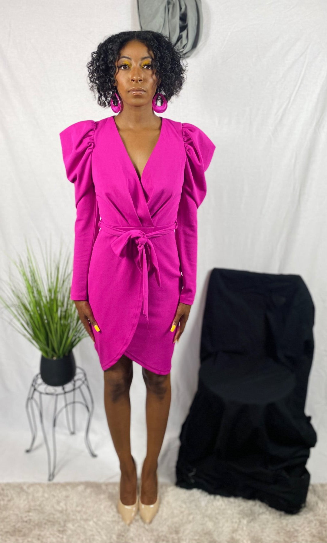 Pink mutton sleeve dress with waist tie and leg slit.